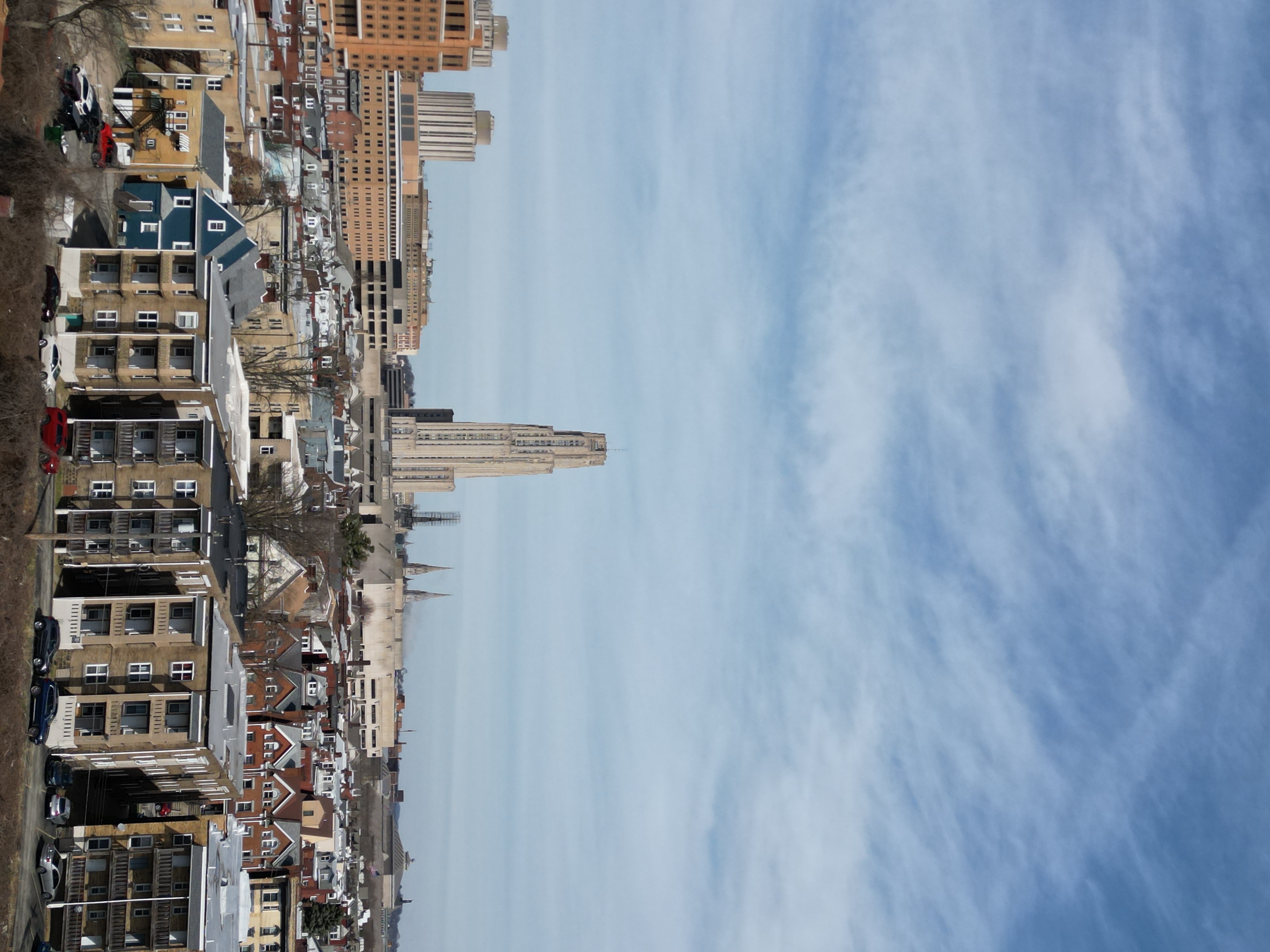 High-angle drone still focused on building footprint and surrounding lot lines